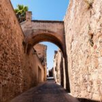 Cáceres: Guided City Highlights Walking Tour - The Walls and Gates: Stepping into the Middle Ages