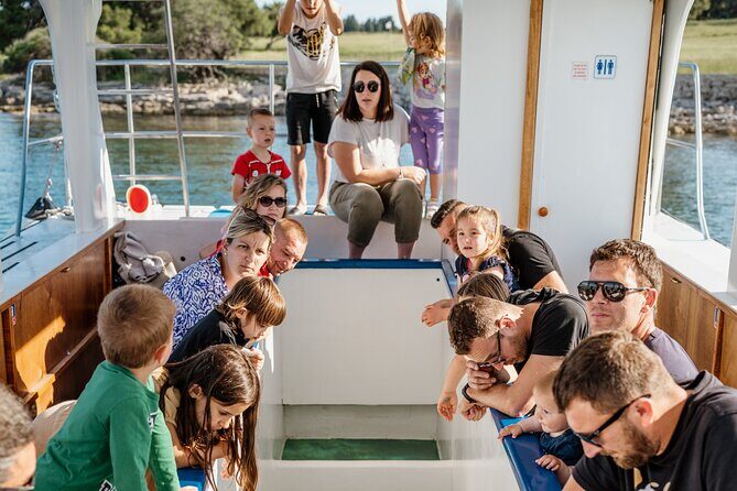 Glass boat tour Faana with swimming stop - The Sum Up