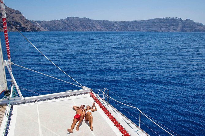 Santorini Cruise on Catamaran with BBQ & Open Bar - Summary of the Experience