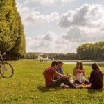 Versailles Bike Tour with Market, Gardens & Guided Palace Tour - Cycling Through Versailles: Gardens, Hamlet & Grand Canal