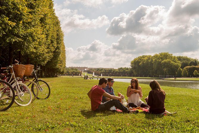 Versailles Bike Tour with Market, Gardens & Guided Palace Tour - Cycling Through Versailles: Gardens, Hamlet & Grand Canal