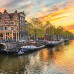 Amsterdam: City Highlights Tour with Canal Cruise - Walking Through the Village