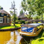 Amsterdam: Giethoorn Tour with Boat Ride & Afsluitdijk Visit - The Sum Up