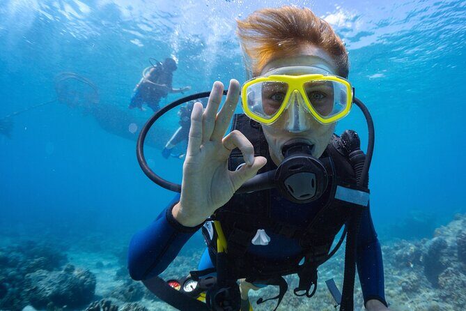 Baptism diving in the turquoise waters of Tahiti - The Virtues of Small Group, Guided Tours