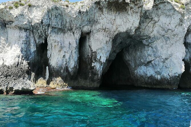 Boat excursion on the island of Ortigia with Snorkeling to the sea caves - The Sum Up