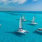 Cancún Catamaran to Isla Mujeres + Snorkel, Open Bar & Lunch - Authentic Experiences Based on Reviews