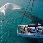 Catamaran Tour to Isla Mujeres, Open bar, Lunch, Snorkeling, Beach Club Included - FAQs