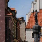 Discover Poznan: Walk, Take a tram and have a traditional snack - Medieval Walls and Modern Districts