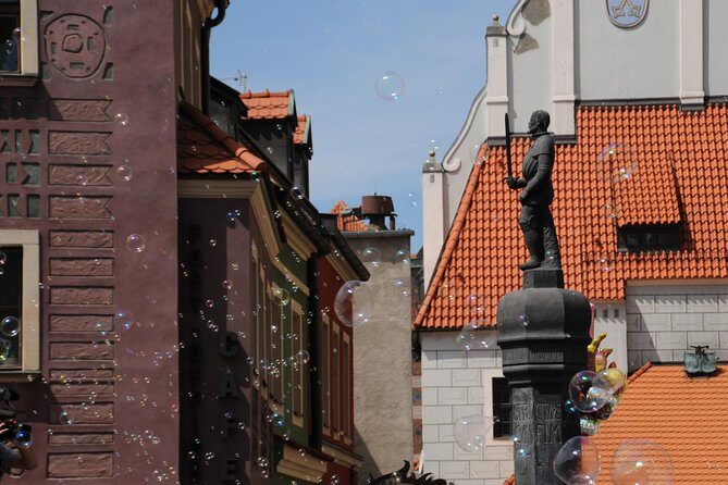 Discover Poznan: Walk, Take a tram and have a traditional snack - Medieval Walls and Modern Districts