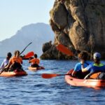 Golfo Aranci: Kayak Tour with Dolphins and Aperitif - Authentic Marine Encounters and Scenic Beauty