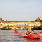 Kayak on the Arno river in Florence under the arches of the Old Bridge - The Sum Up