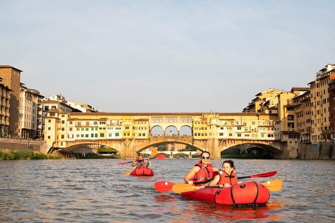 Kayak on the Arno river in Florence under the arches of the Old Bridge - The Sum Up