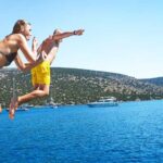 Lisbon: Sightseeing Cruise with Open Bar, DJ & Swim Stop - Experience Breakdown and What to Expect