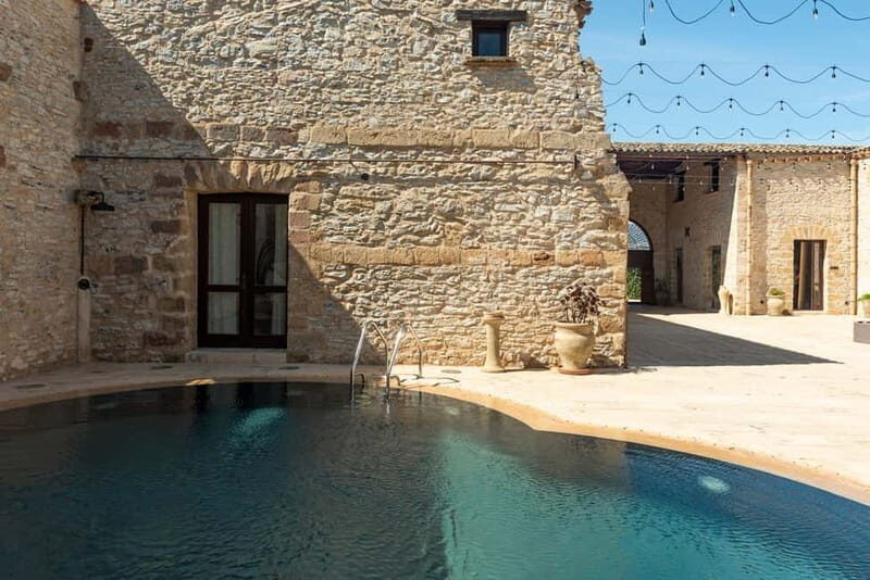 Nature and relaxation by the pool at Baglio Passofondo Estates - Why This Tour Offers Great Value