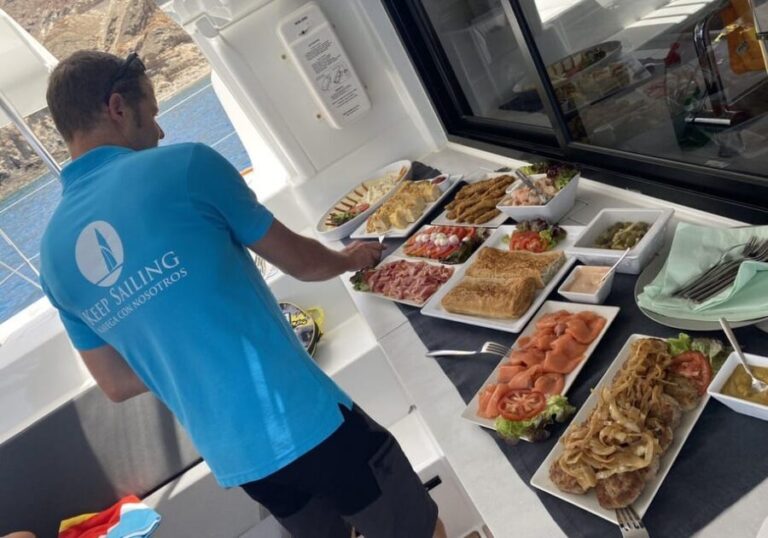 Pasito Blanco: Private catamaran excursion with food & drink - The Sum Up