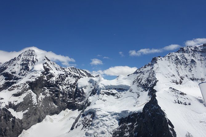 Private Swiss Alps helicopter tour over snow covered mountain peaks and glaciers - FAQs