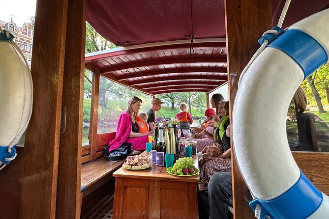 Riga: Evening or Sunset Boat Tour with Drink and Audio Guide - A Closer Look at the Experience