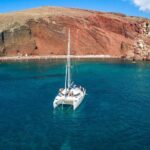Santorini Half Day Catamaran Private Cruise incl. Meal, Drinks & Free Transport - The Sum Up