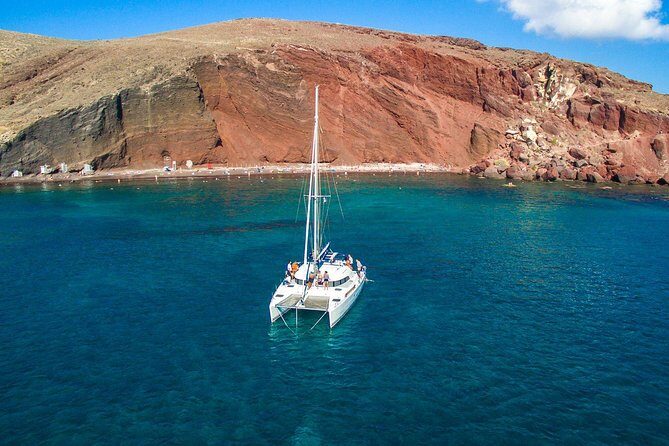 Santorini Half Day Catamaran Private Cruise incl. Meal, Drinks & Free Transport - The Sum Up