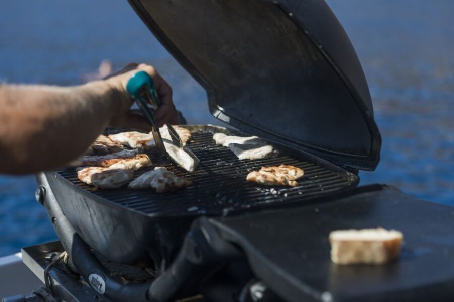 Santorini: Traditional Wooden Boat Tour with Meal and Wine - Who Should Consider This Tour?