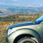 Tour to the Waterfalls in 4x4 full day - Midday History: Tourim Bridge and Cultural Insights