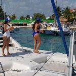 Wild adult catamaran party sailing to Isla Mujeres - A Detailed Look at the Wild Adult Catamaran Tour