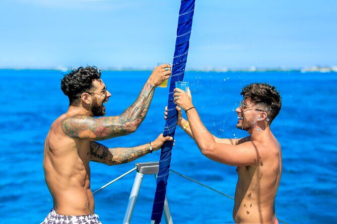 Catamaran to Isla Mujeres Snorkeling Tour with Open Bar and Lunch - The Scenic Sail and Parachute Ride