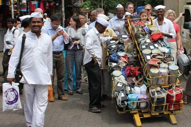 Dabbawala, Dhobi Ghat & Dharavi slum Tour with Local Train Ride - The Sum Up