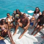 Isla Mujeres Rush : Catamaran Snorkeling and BUFFET in Beach Club - Arrival at Isla Mujeres and Beach Club Relaxation