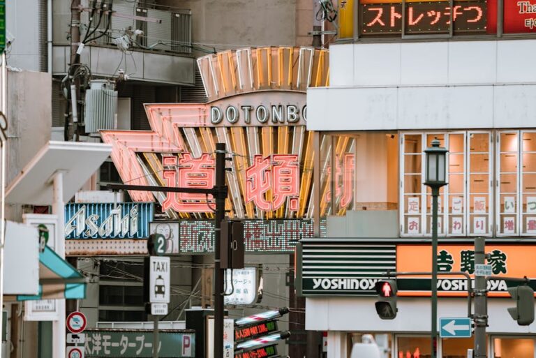 Street signs and vibrant city life in Dotonbori, O