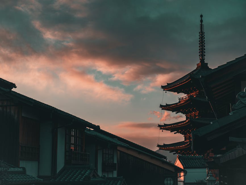 Dramatic sunset behind traditional Japanese architecture in 