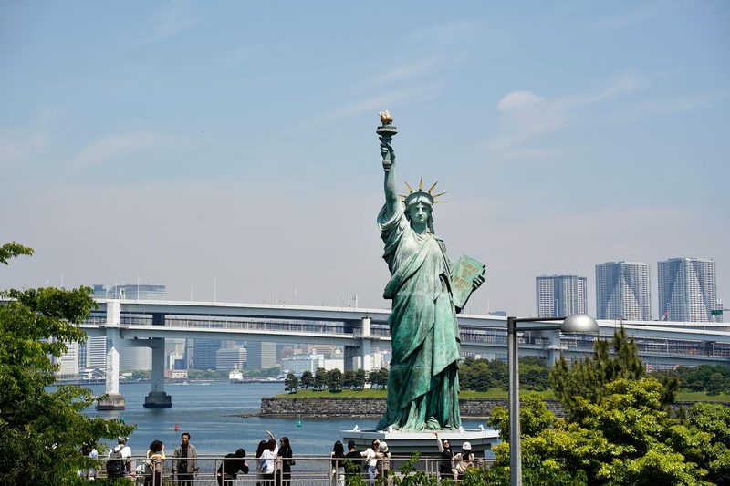 Statue of Liberty replica at Odaiba with Tokyo Bay skyline