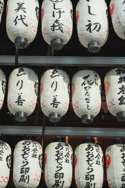 Close-up of traditional lanterns hanging at Yasaka Shrine in Kyoto, showcasing cultural heritage.