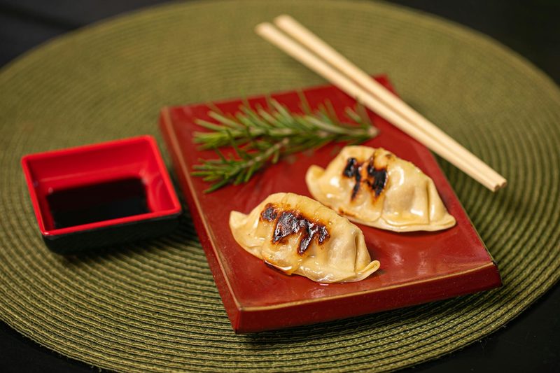 Gyoza dumplings with soy sauce on a plate