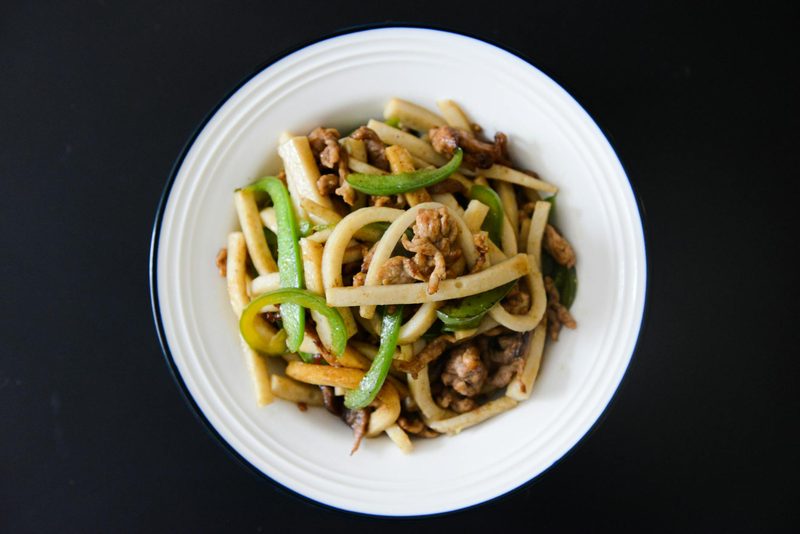 Stir-fried udon noodles with pork and fresh vegetables