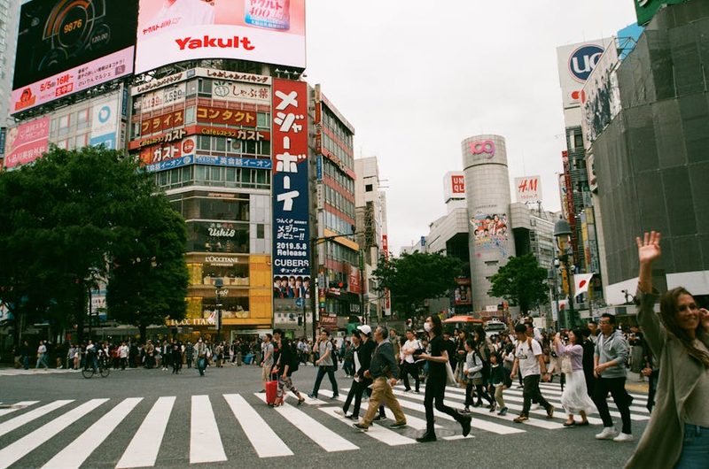 A vibrant scene of people crossing the famous Shibuya Intersection in Tokyo, Japan, capturing urban life.