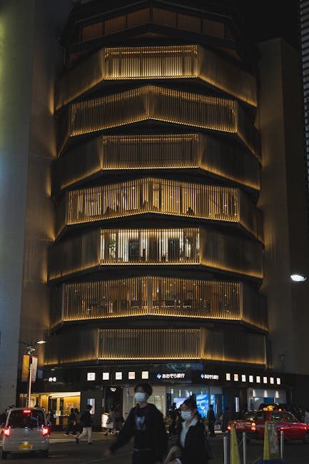 A beautifully lit contemporary building in Tokyo, Japan, showcasing modern architecture at night.