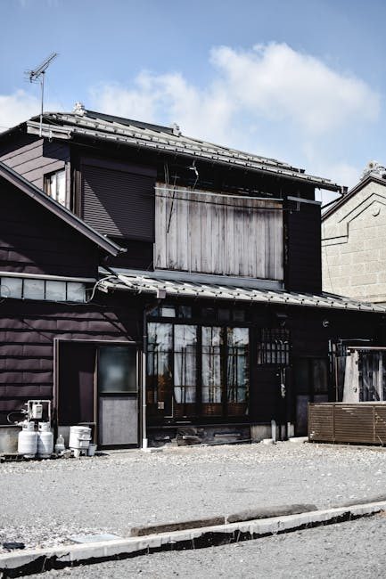 Explore the rustic charm of a traditional wooden house in Nikko, Japan under a clear blue sky.