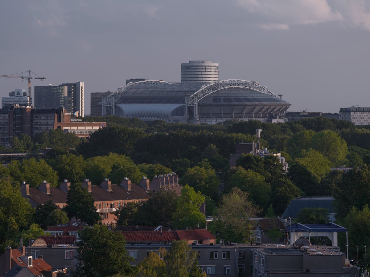 Aerial view of the Johan Cruyff Arena and surrounding Amsterdam cityscape