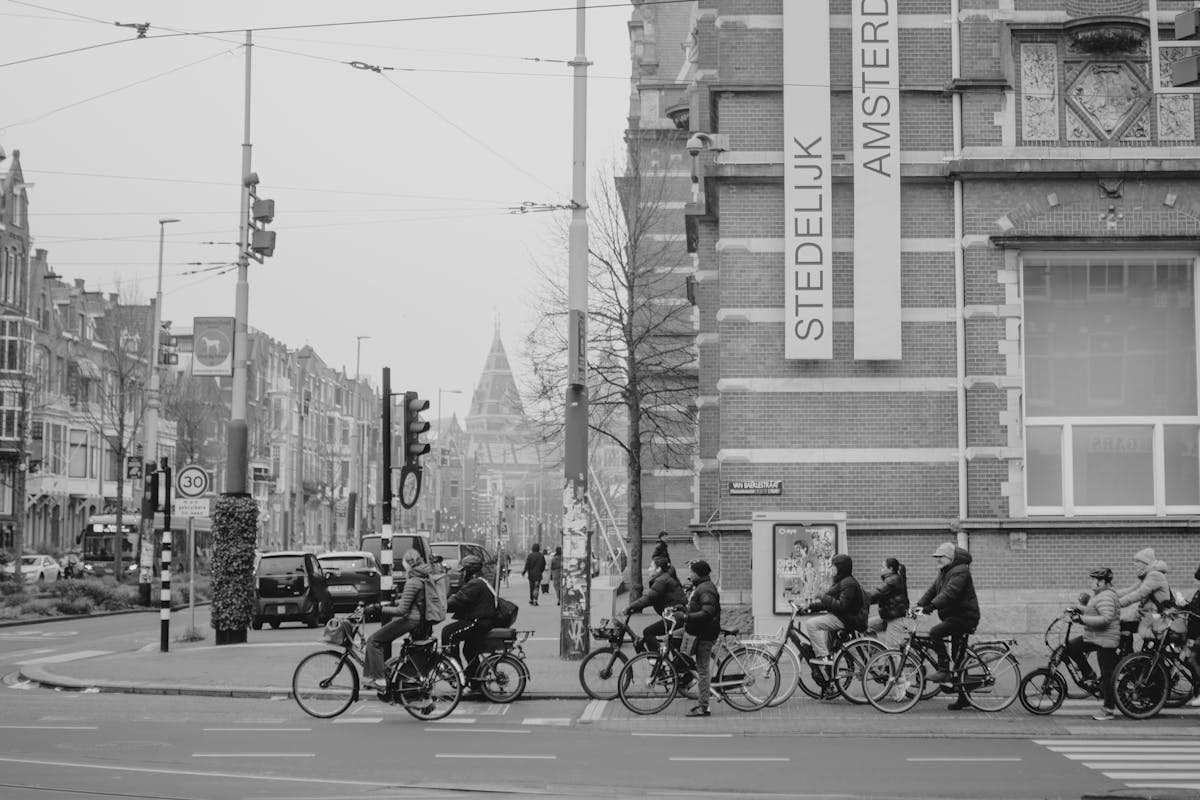 Cyclists waiting at traffic light on Amsterdam street
