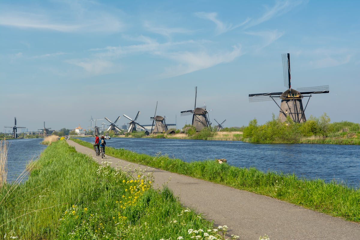 Cycling along the canal at Kinderdijk with windmills