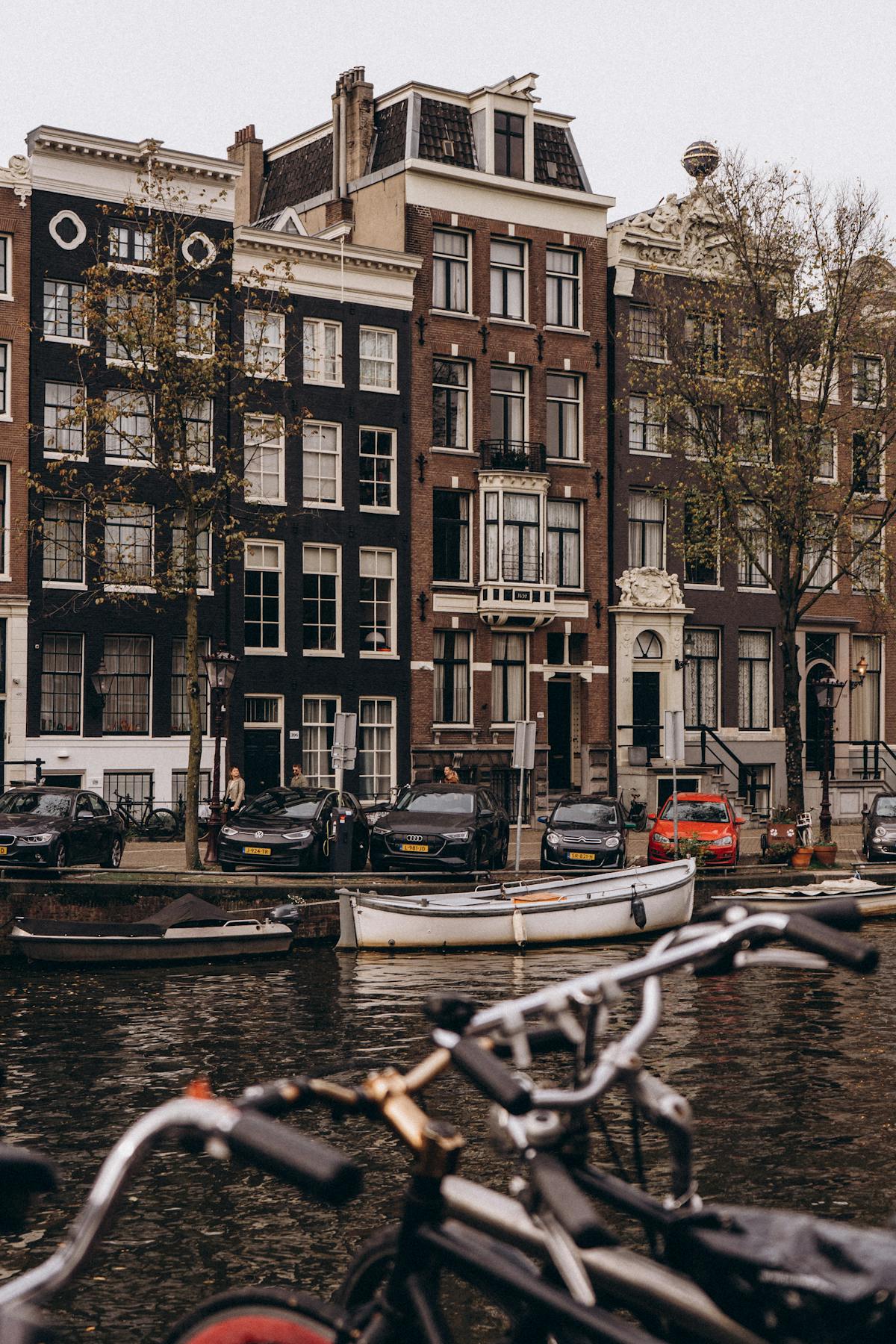 Traditional Amsterdam canal houses with bikes in the foreground