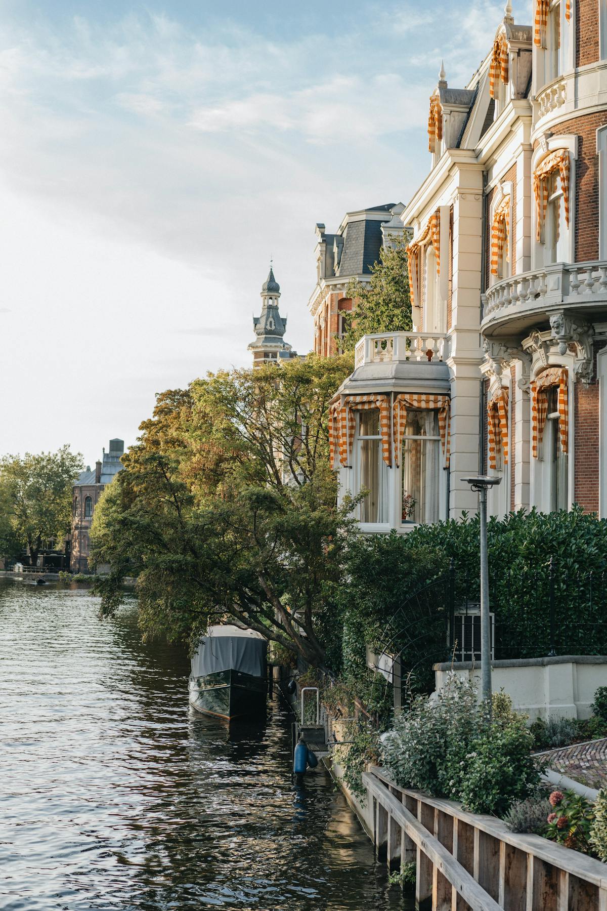 Amsterdam canal with autumn foliage and classic architecture