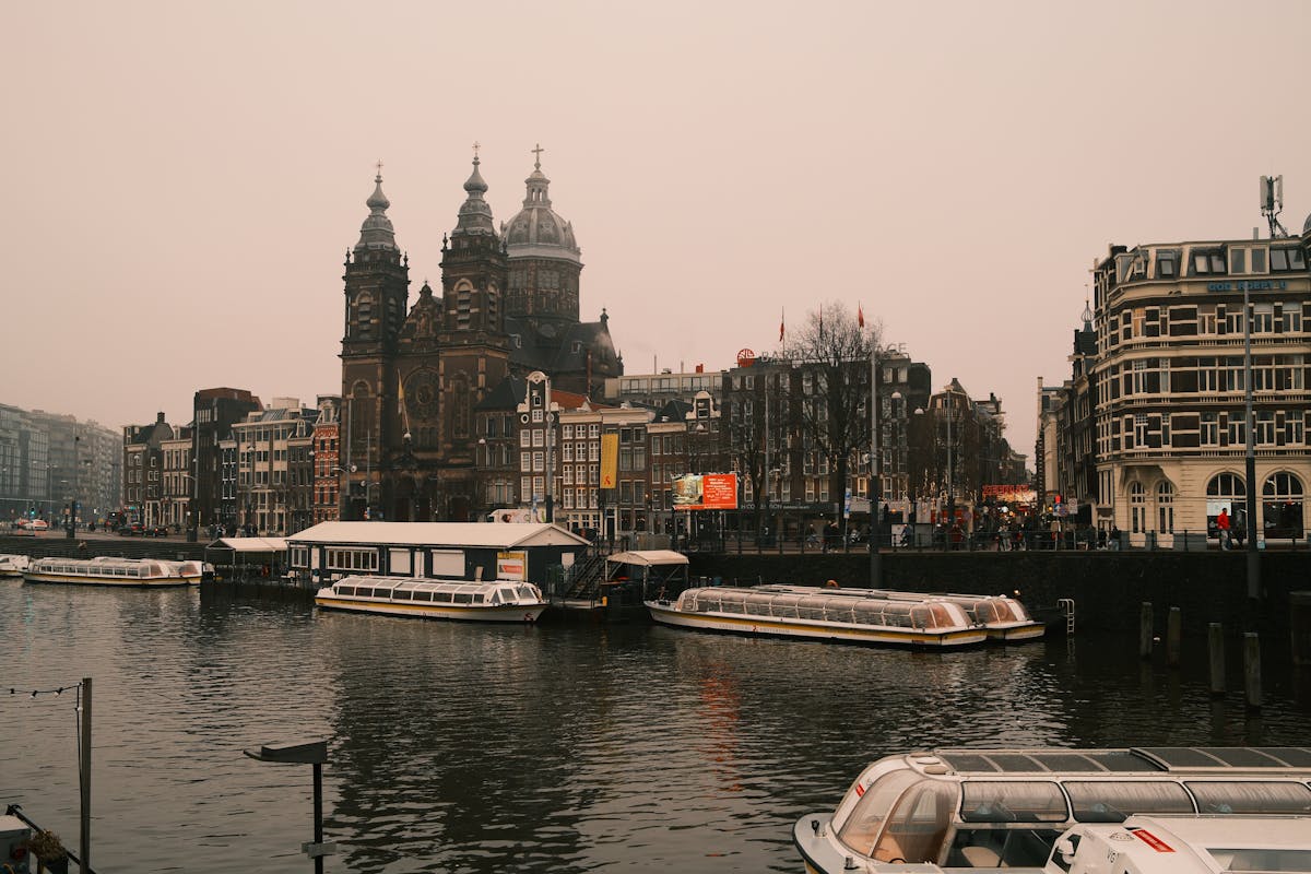 Amsterdam canal and historic buildings in fog