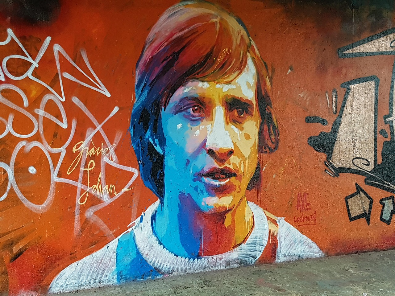 Street art graffiti tribute to Johan Cruyff on a wall in Amsterdam