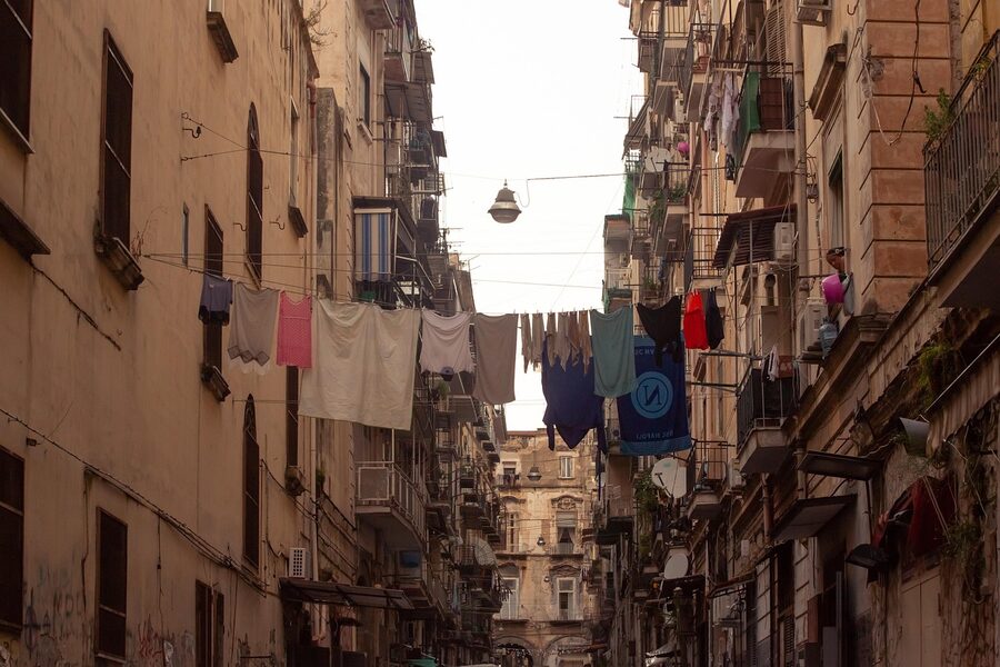 Typical Naples street with laundry hanging between buildings