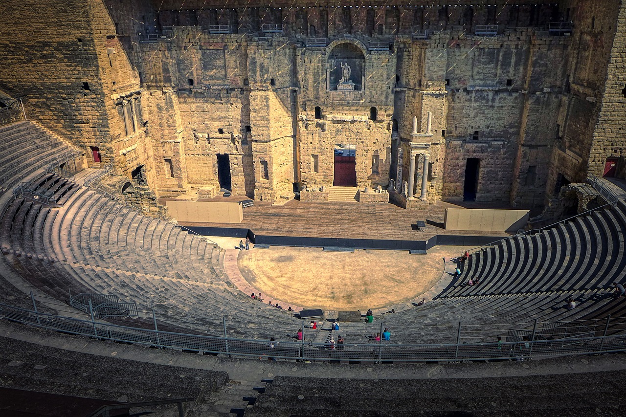 Roman theatre of Orange with stone seating and grand stage wall in France