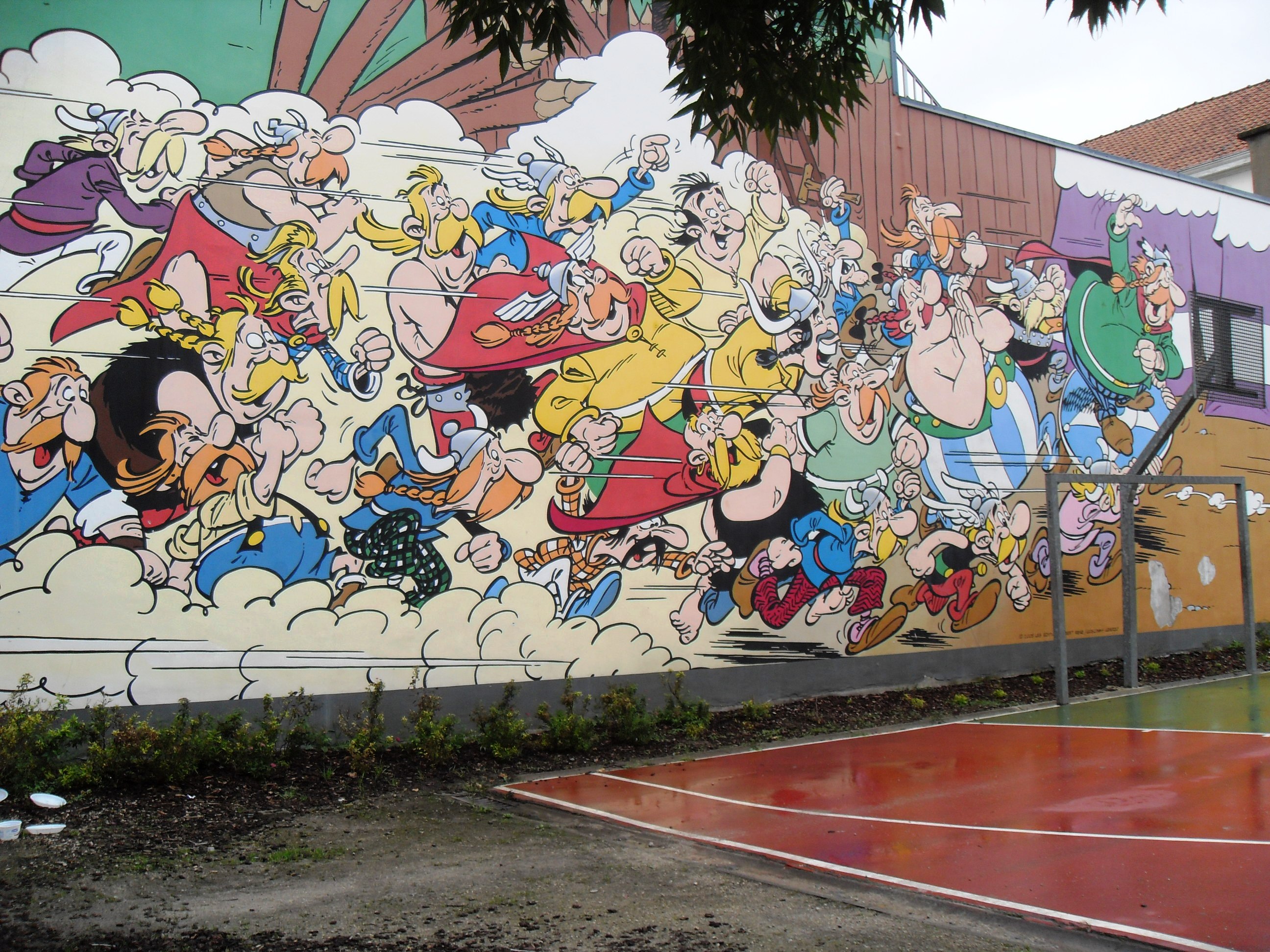 Large comic wall mural of Asterix and Obelix characters by Goscinny and Uderzo in Brussels
