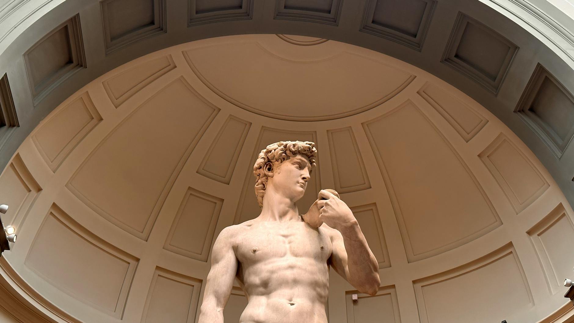 Looking up at Michelangelo David sculpture under the dome of the Accademia Gallery Florence