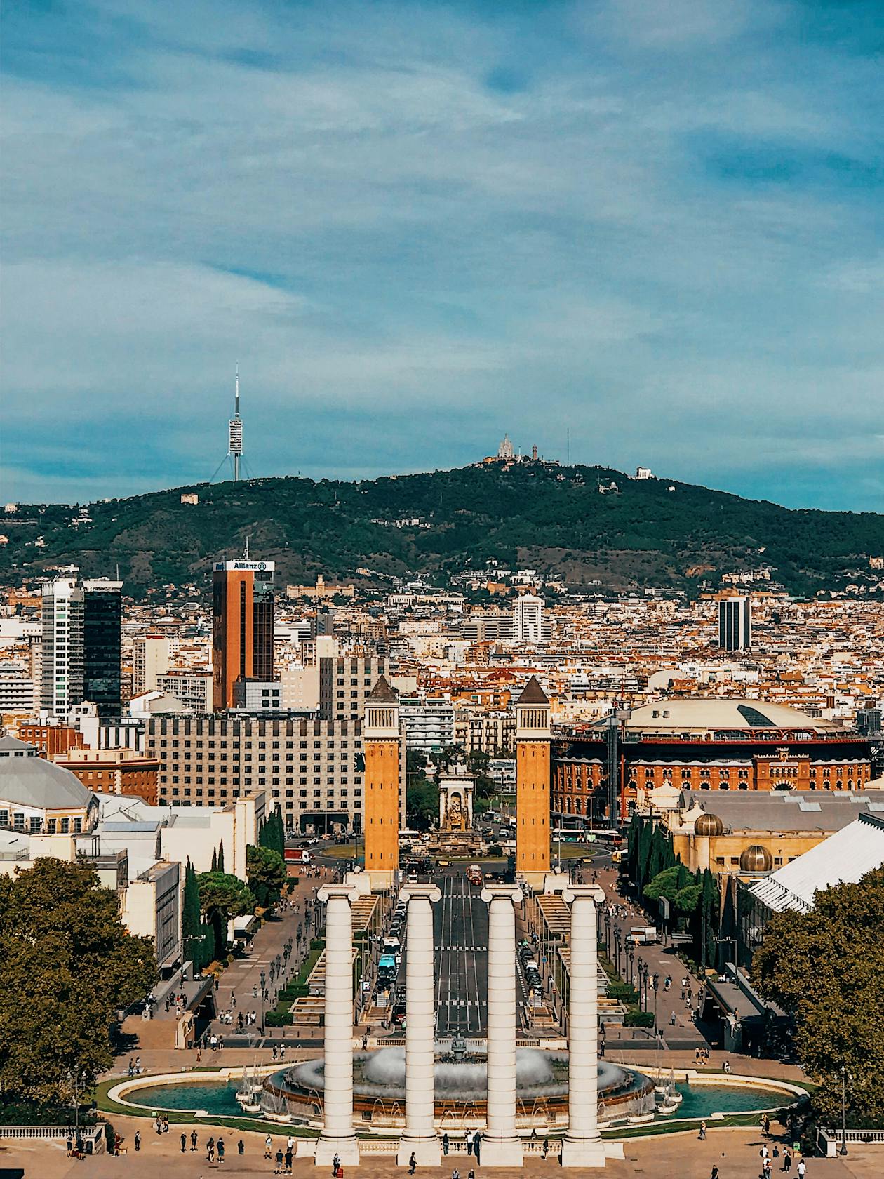 Aerial view of Barcelona showcasing Montjuic Hill and surrounding architecture